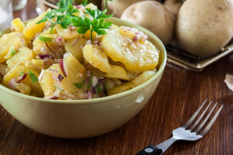 Potato salad with fresh parsley decorated on top